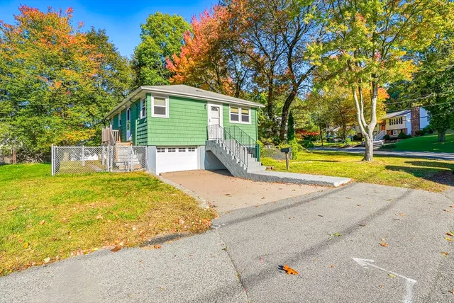a house with swimming pool in front of it