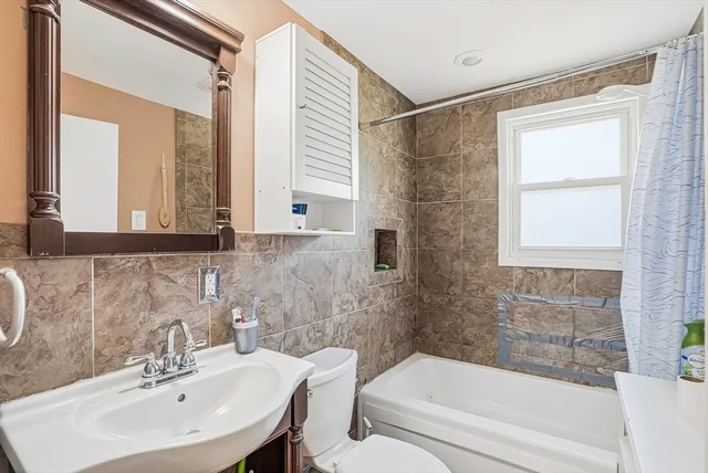 a kitchen with granite countertop a sink and cabinets