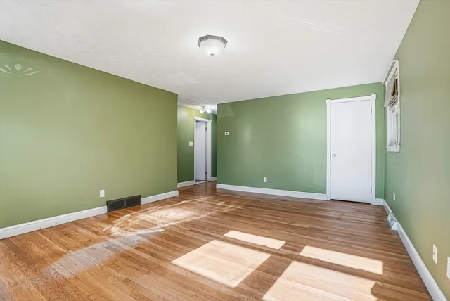 a view of a big room with windows and closet