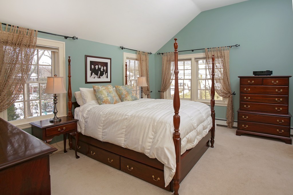 14 Pilgrim Road Wellesley, MA 02481 - Photo 12 of 20 a bed sitting in a bedroom next to a window