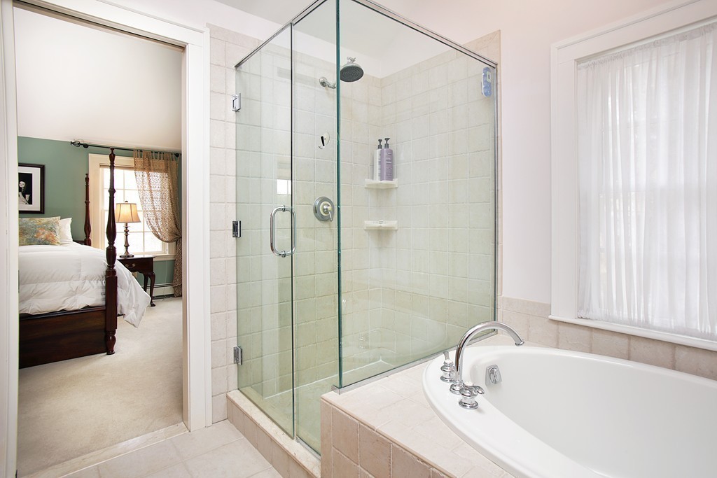 14 Pilgrim Road Wellesley, MA 02481 - Photo 13 of 20 a bathroom with a tub shower and sink