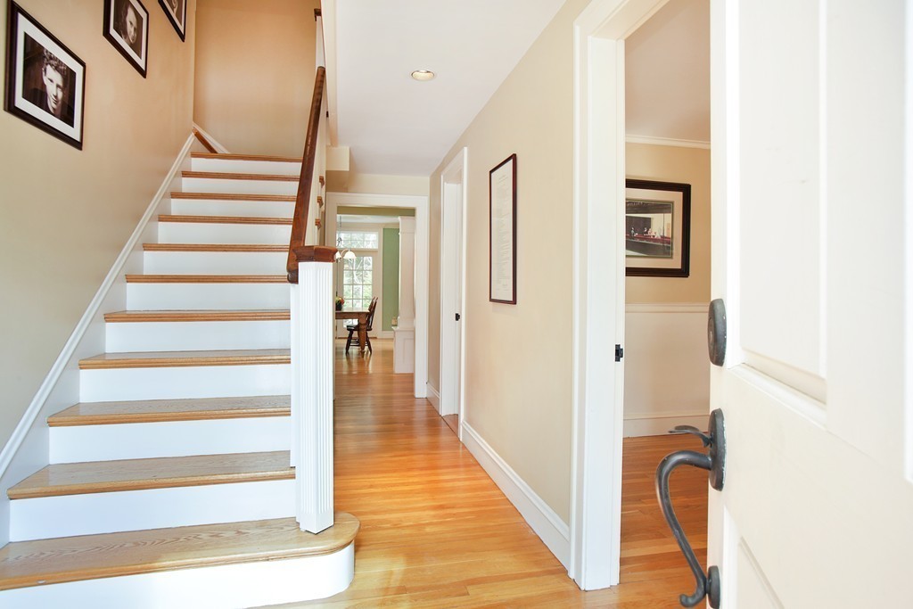 14 Pilgrim Road Wellesley, MA 02481 - Photo 4 of 20 a view of a hallway with wooden floor and entryway