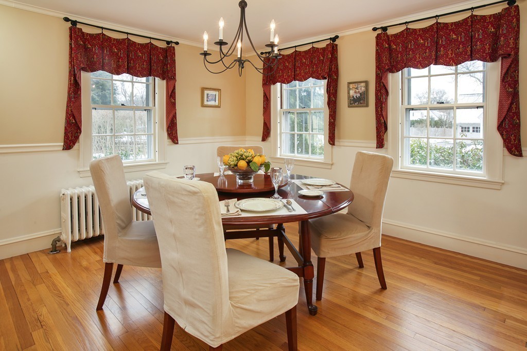 14 Pilgrim Road Wellesley, MA 02481 - Photo 5 of 20 a dining room with furniture a chandelier and wooden floor