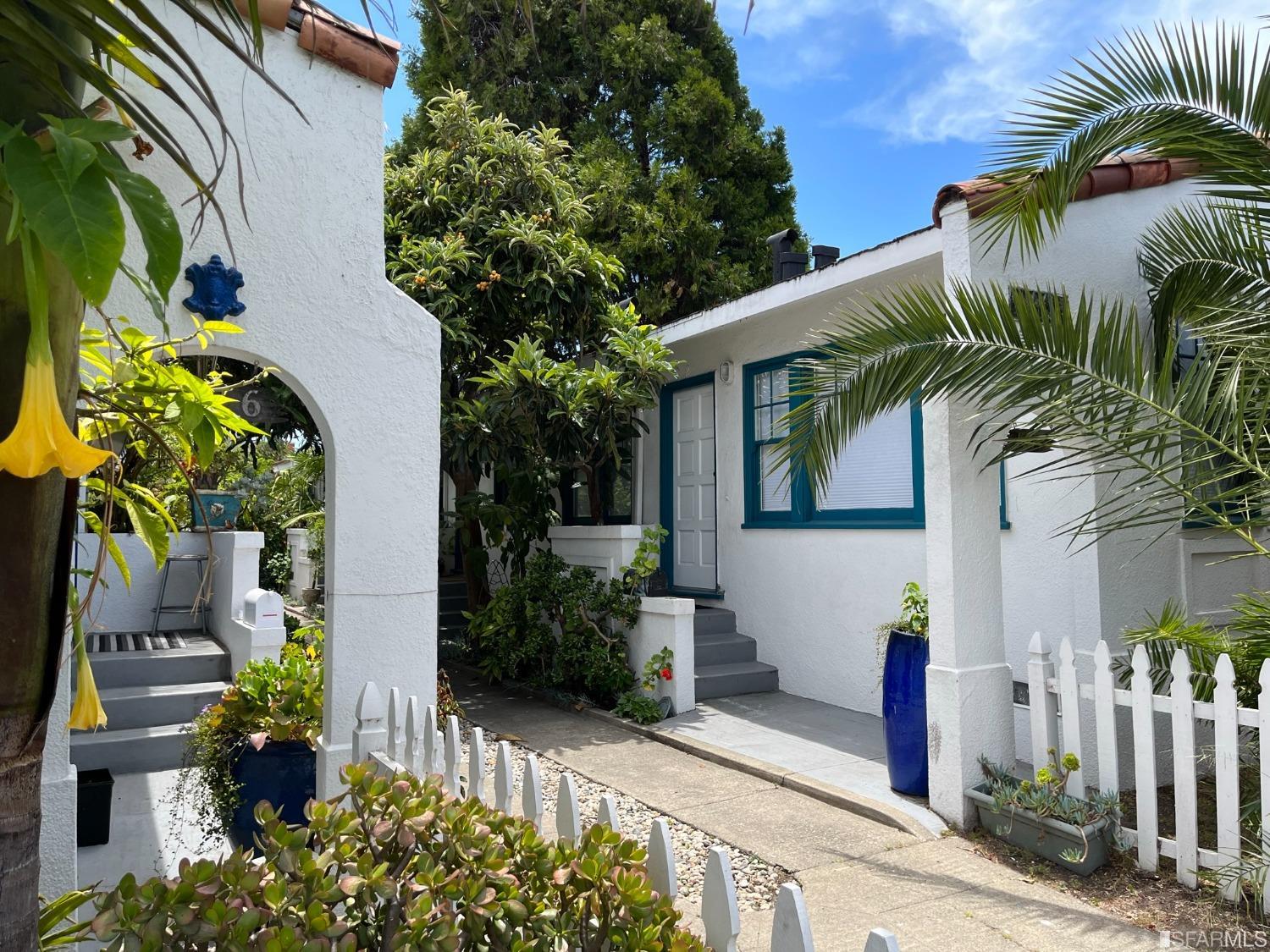 1114-1116 Dwight Way Berkeley, CA 94702 - Photo 2 of 8 a front view of a house with a tree