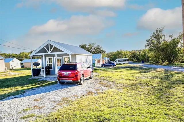 a view of yard with car parked