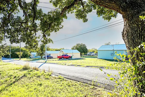 a view of a backyard of the house