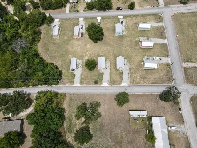 an aerial view of a house with outdoor space