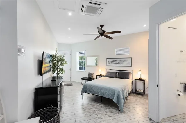 a bedroom with a bed furniture and a window