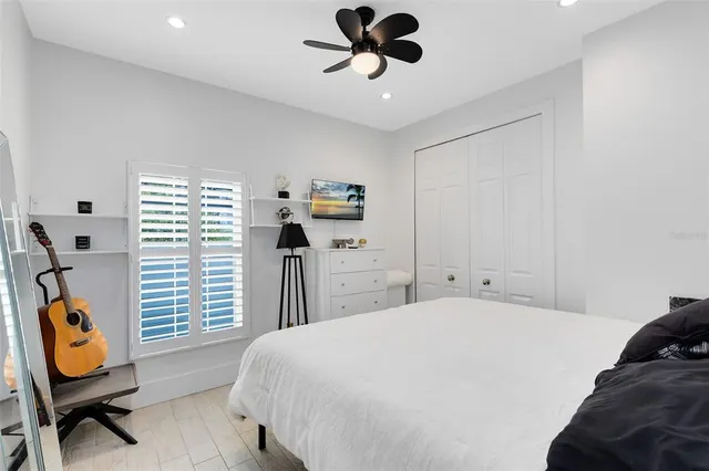 a bedroom with a bed and a chair