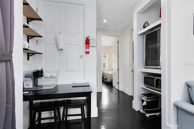 a view of kitchen with furniture and wooden floor