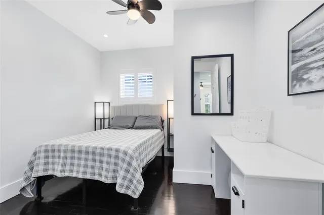 a bedroom with a bed and a table in it