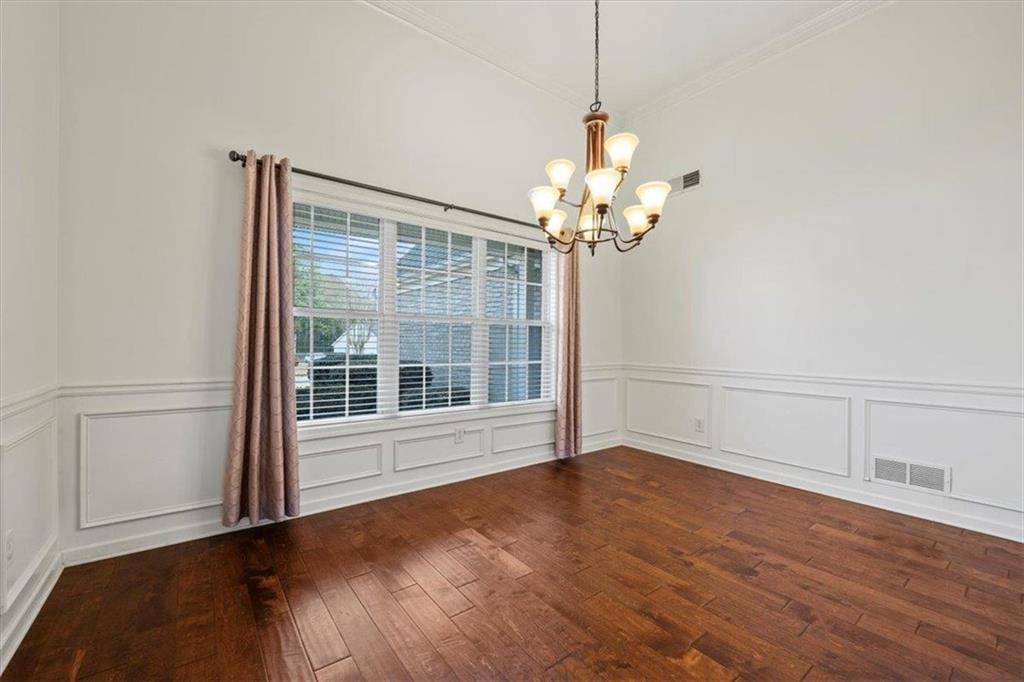 1218 Morgans Run Monroe, GA 30656 - Photo 31 of 39 a view of an empty room with a window and wooden floor