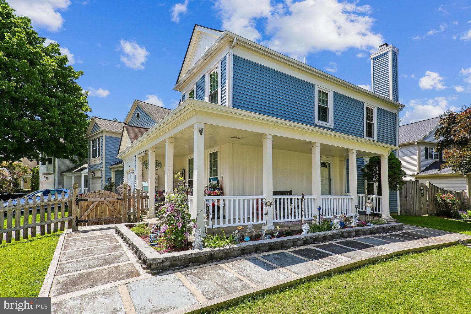 14822 Rose Trellis Place Silver Spring, MD 20906 - Photo 2 of 65 a front view of a house with garden