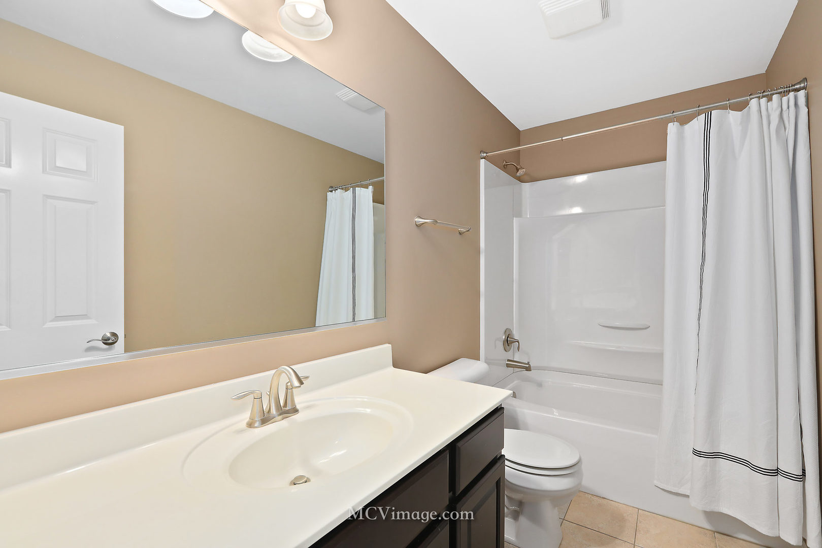 2959 Church Road Aurora, IL 60502 - Photo 22 of 36 a bathroom with a sink a toilet and shower