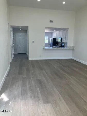 a view of a kitchen with a sink and cabinets