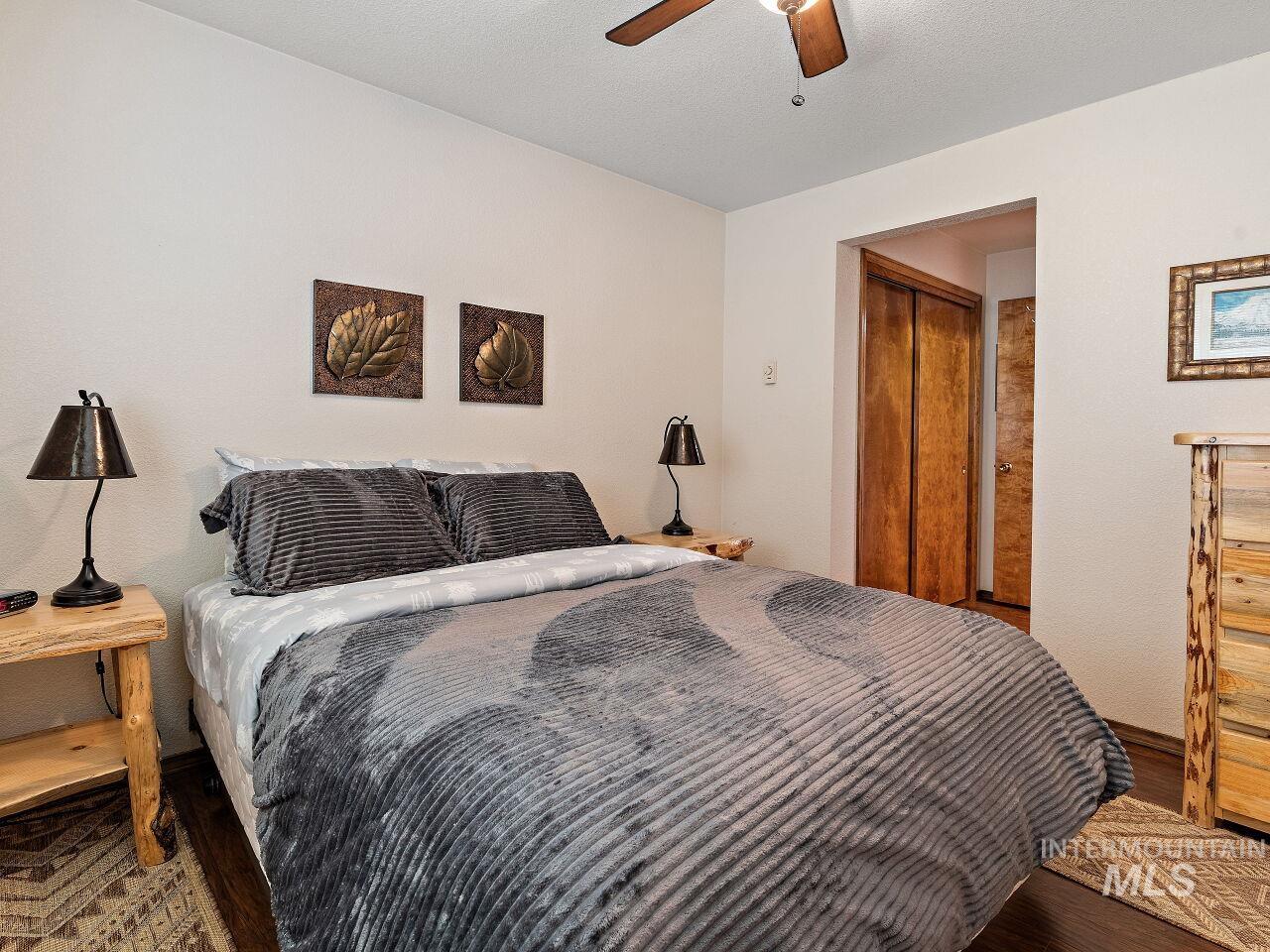 601 Hemlock Street, Unit 10 McCall, ID 83638 - Photo 33 of 43 Bedroom with wood finished floors and a ceiling fan