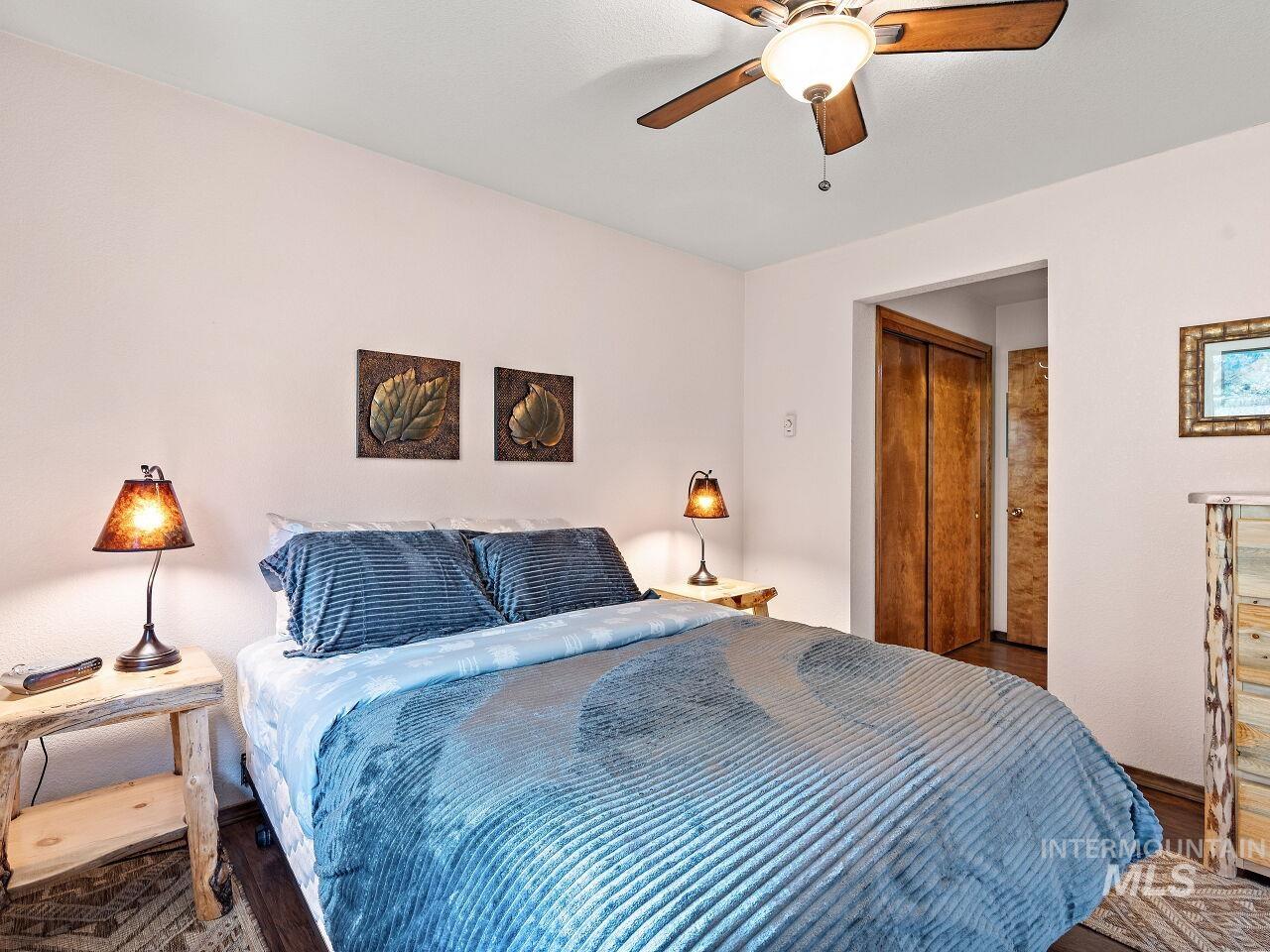 601 Hemlock Street, Unit 10 McCall, ID 83638 - Photo 35 of 43 Bedroom with wood finished floors and ceiling fan