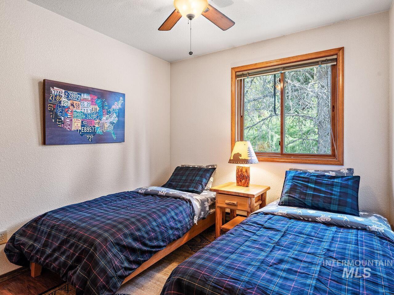 601 Hemlock Street, Unit 10 McCall, ID 83638 - Photo 39 of 43 Bedroom featuring wood finished floors and a ceiling fan