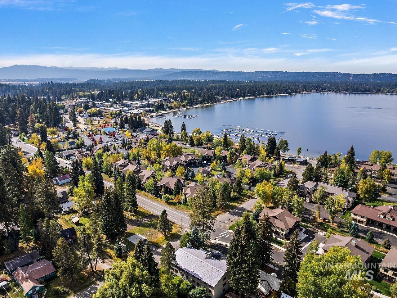 601 Hemlock Street, Unit 10 McCall, ID 83638 - Photo 4 of 43 Aerial view of property and surrounding area with a water and mountain view and nearby suburban area