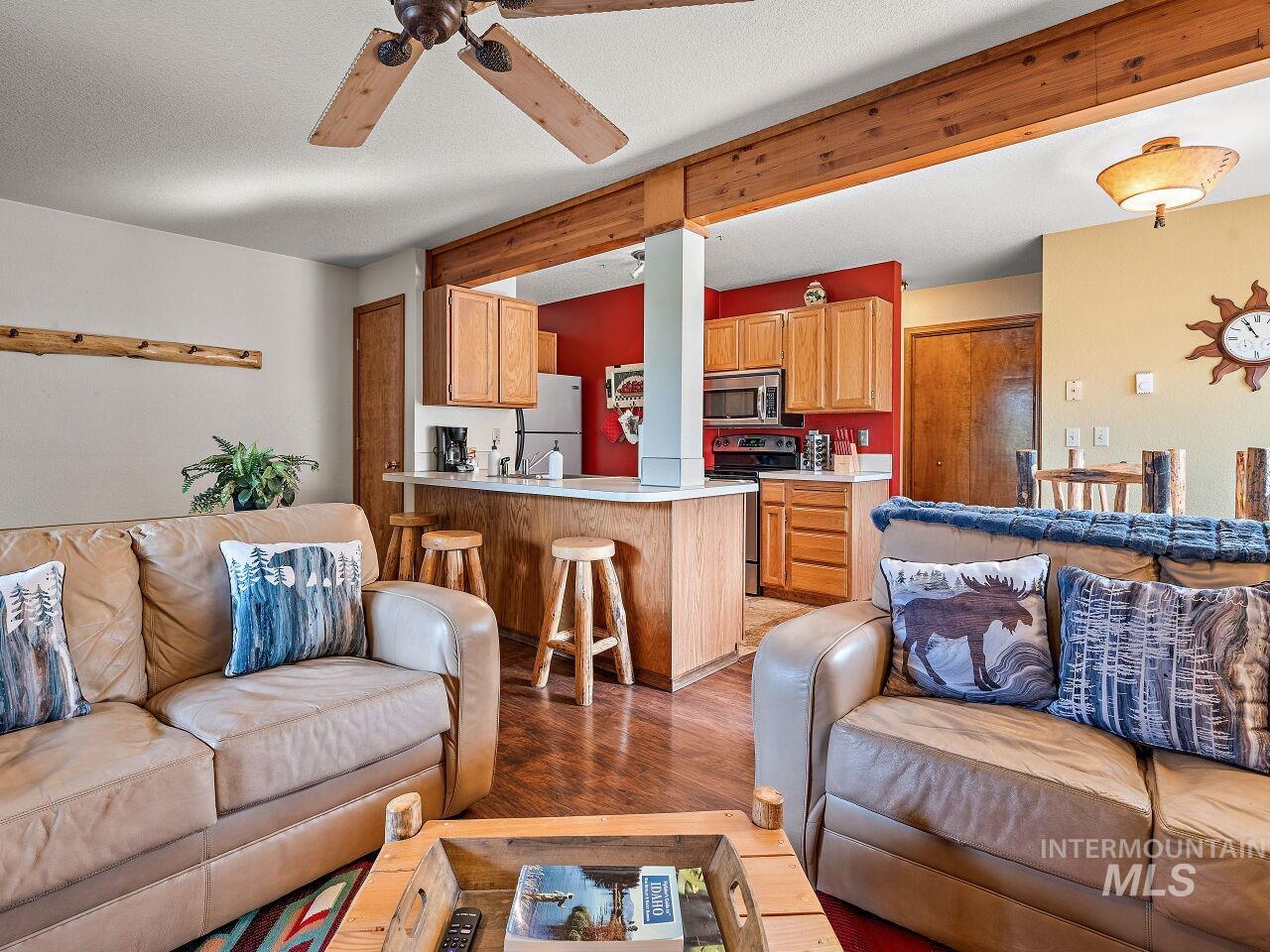 601 Hemlock Street, Unit 10 McCall, ID 83638 - Photo 7 of 43 Living area featuring light wood-type flooring and a ceiling fan