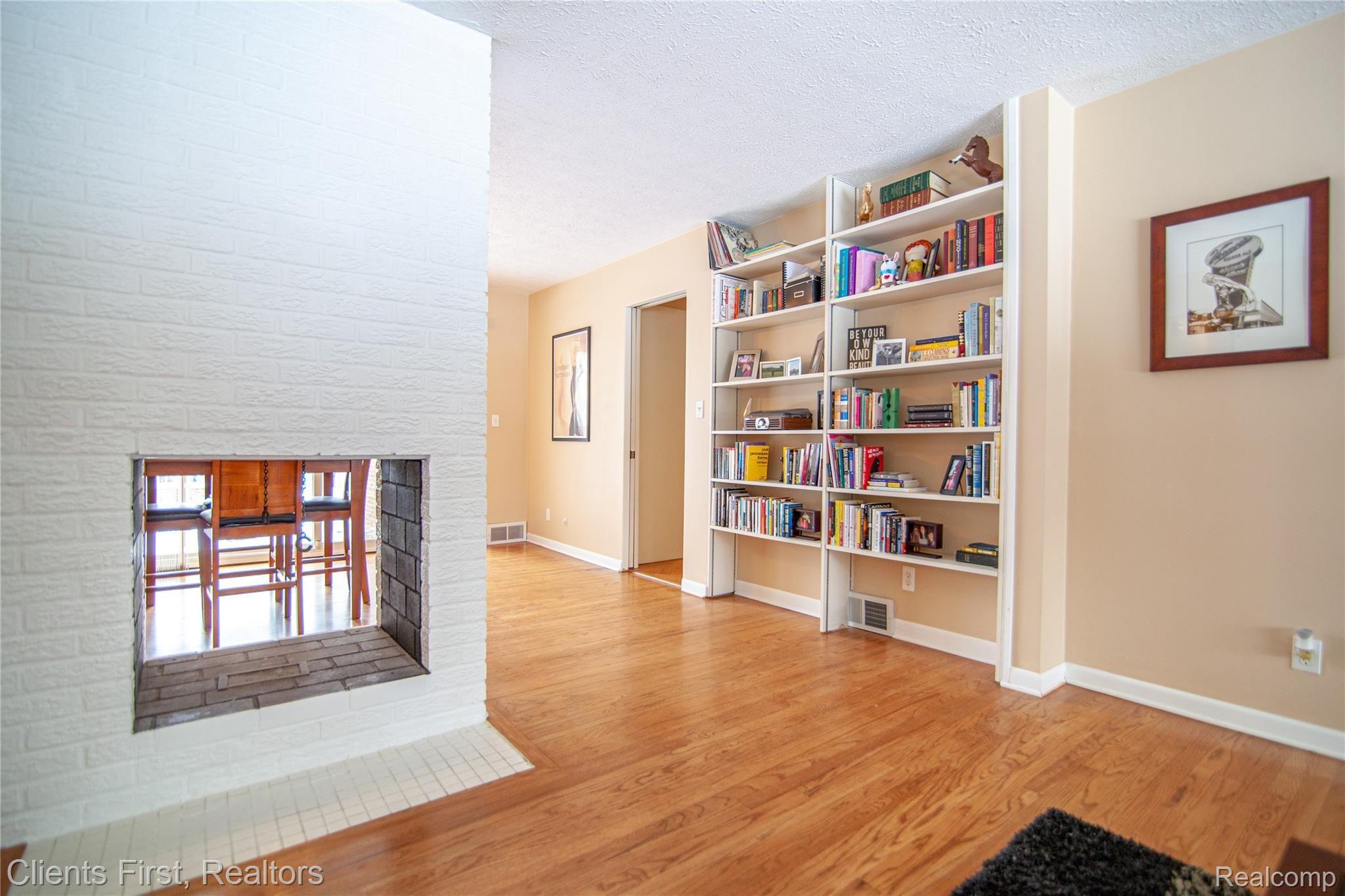 32333 Craftsbury Road Farmington, MI 48334 - Photo 7 of 32 Fire place and bookshelf