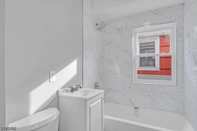 a bathroom with a sink a toilet and a bathtub