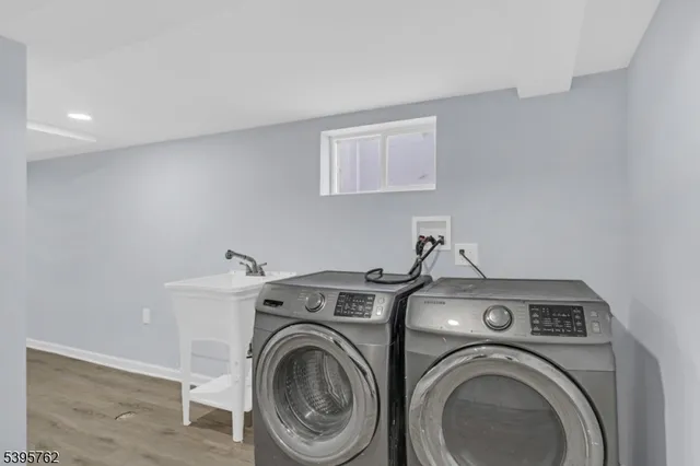a view of storage and utility room with washer and dryer