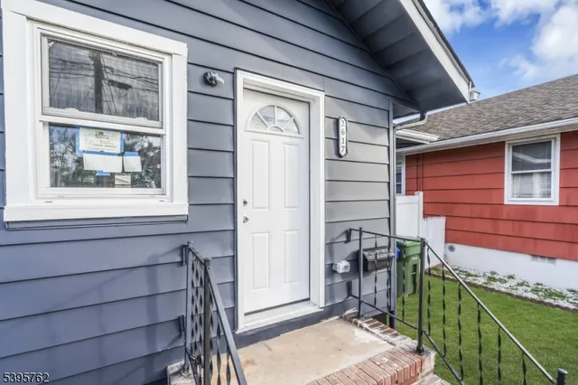 a front view of a house with a large window