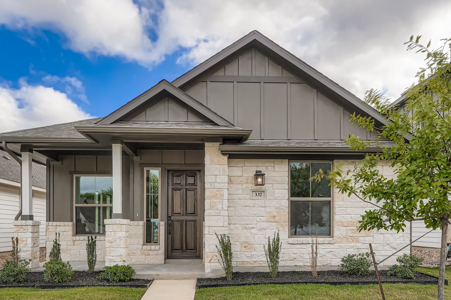 a front view of a house with a yard