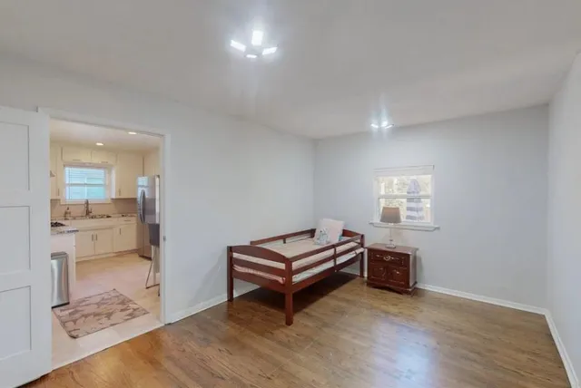 a room with furniture and a wooden floor