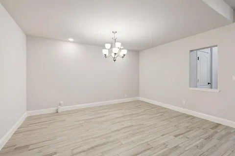 a view of a livingroom with wooden floor