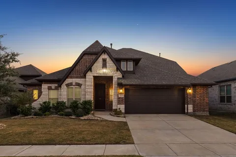 a front view of a house with yard