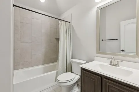 a bathroom with a sink a toilet and a bathtub