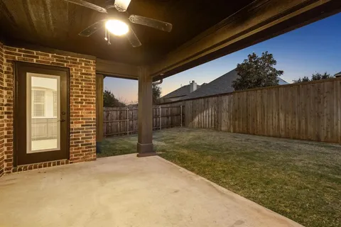 a view of a backyard of the house