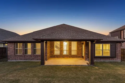 a house view with swimming pool in front of it