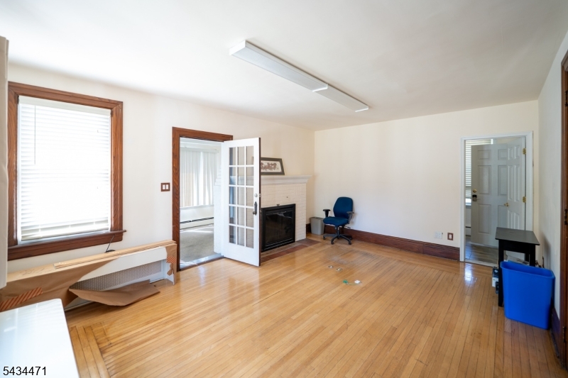 192 Lincoln Road Phillipsburg, NJ 08865 - Photo 16 of 50 a view of empty room with wooden floor and fan