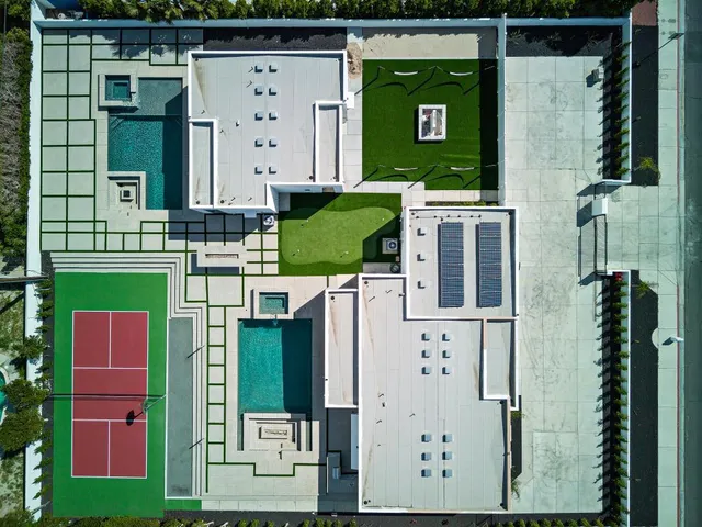 a view of a swimming pool with an outdoor seating