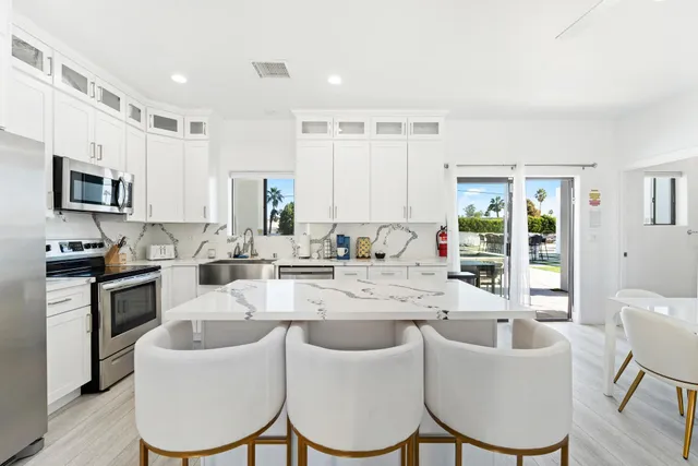a bathroom with double vanity sink and a mirror