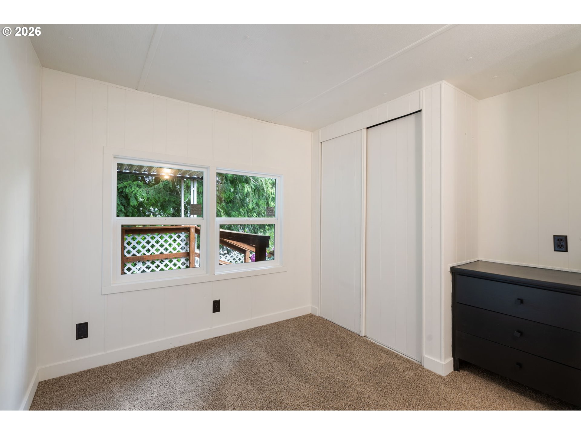 15130 South Maplelane Road, Unit 50 Oregon City, OR 97045 - Photo 19 of 36 a view of an empty room with a window