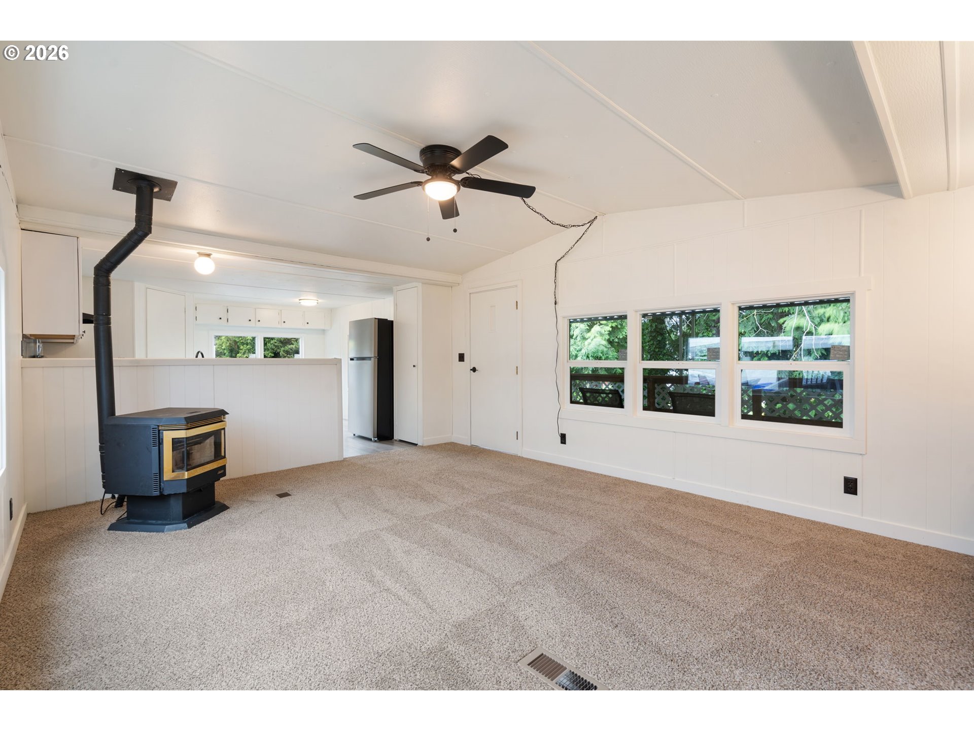 15130 South Maplelane Road, Unit 50 Oregon City, OR 97045 - Photo 4 of 36 a view of an empty room with a window