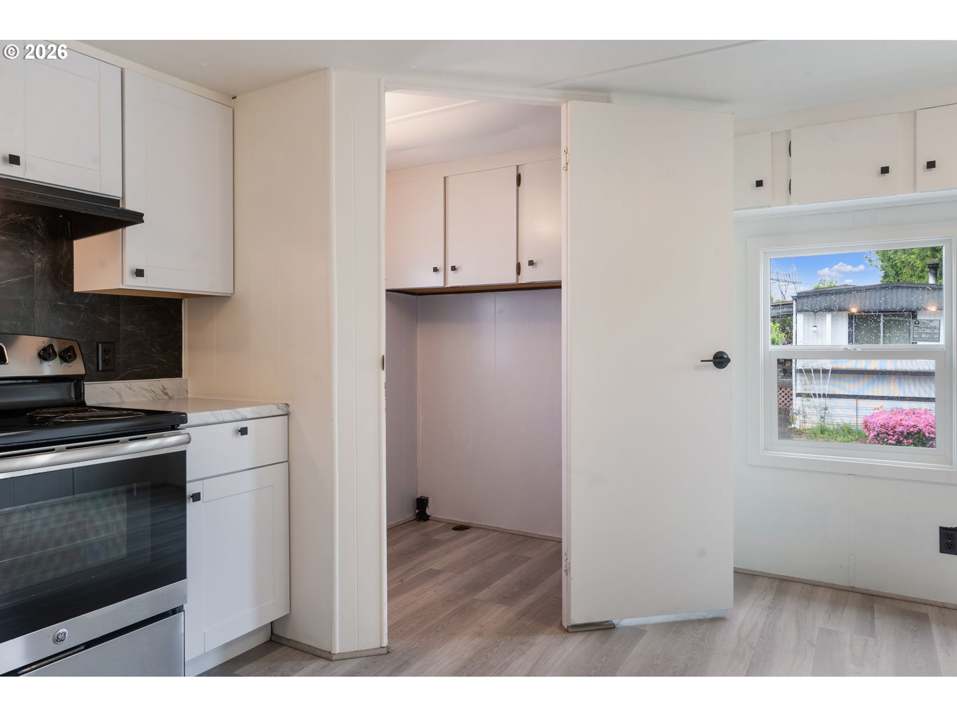 15130 South Maplelane Road, Unit 50 Oregon City, OR 97045 - Photo 9 of 36 a kitchen with cabinets and a stove