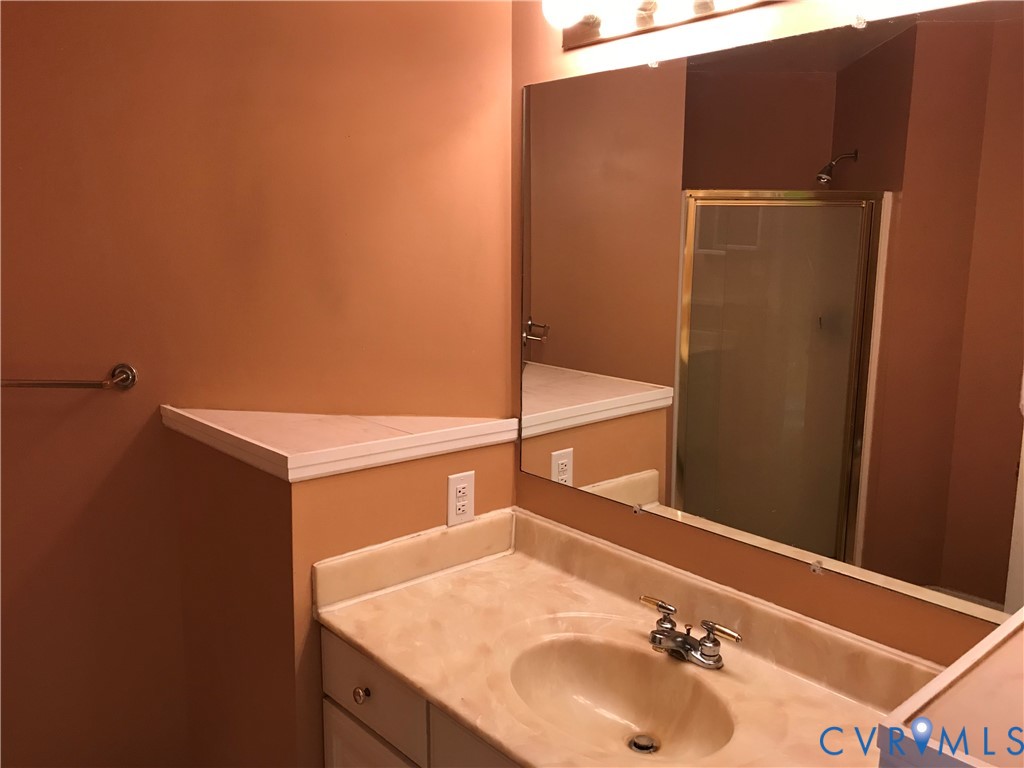 2395 State Rte 635 Midlothian, VA 23113 - Photo 12 of 38 a bathroom with a sink and a mirror