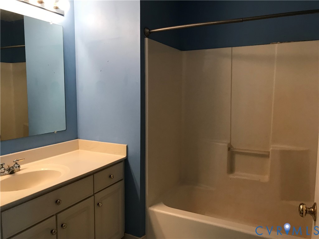 2395 State Rte 635 Midlothian, VA 23113 - Photo 23 of 38 a bathroom with a granite countertop sink and a bathtub