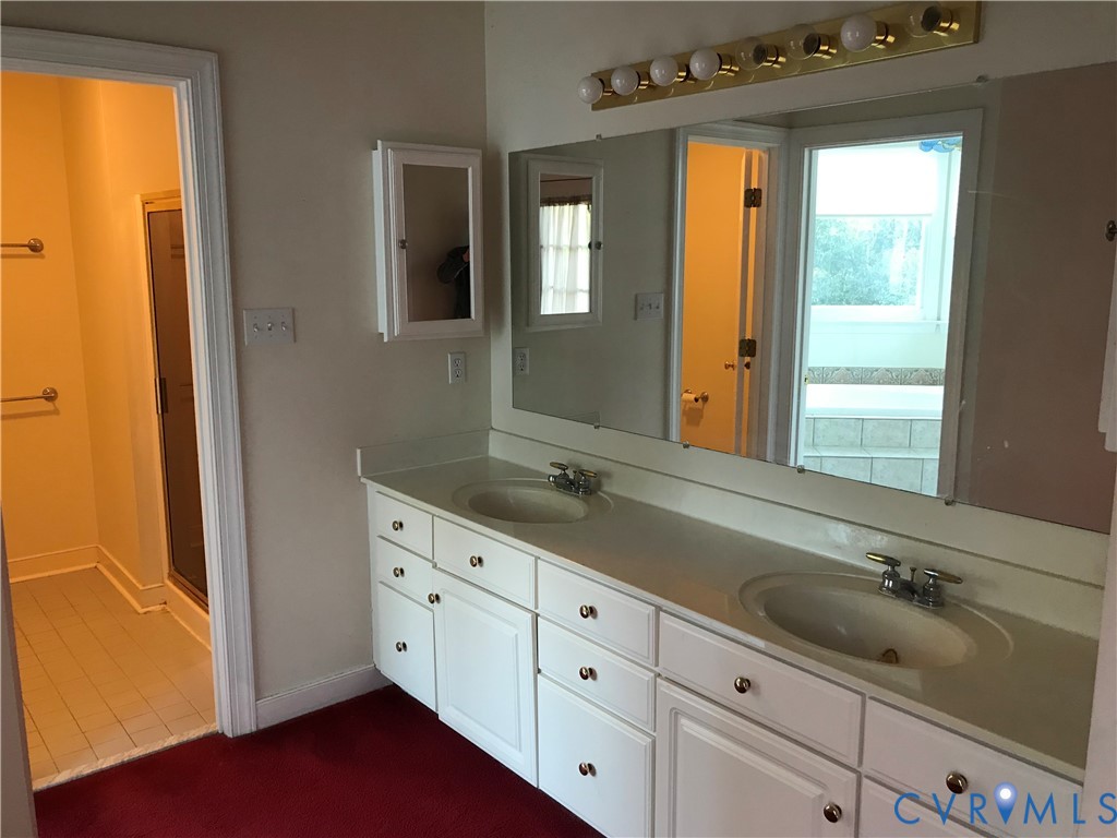2395 State Rte 635 Midlothian, VA 23113 - Photo 30 of 38 a bathroom with a granite countertop sink mirror and double