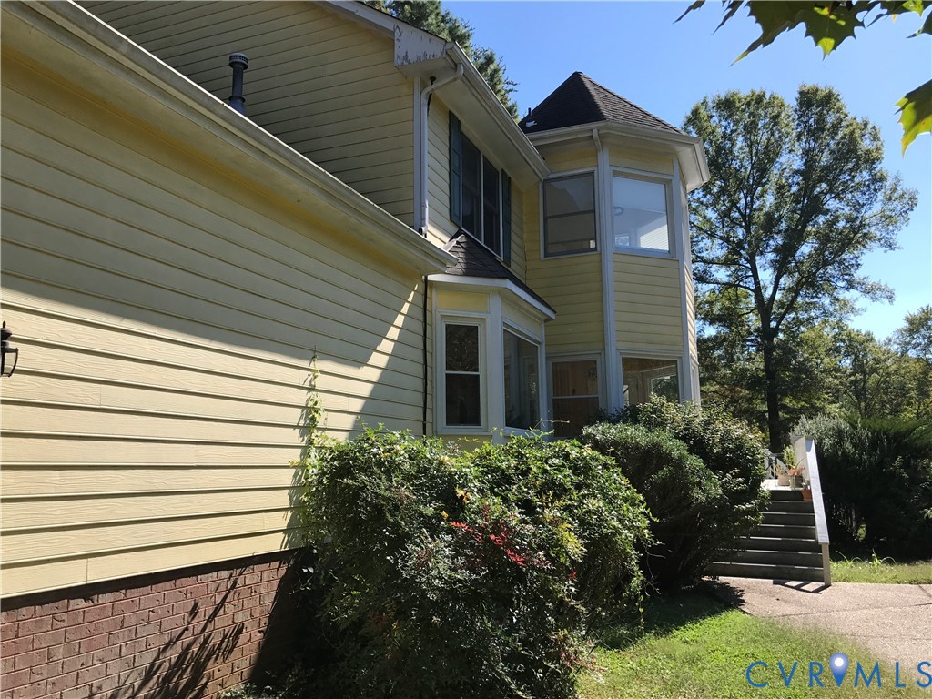 2395 State Rte 635 Midlothian, VA 23113 - Photo 4 of 38 a view of a house with a yard