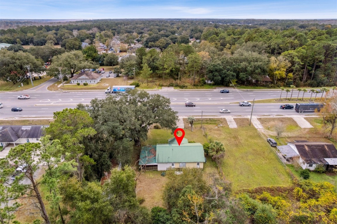 463465 State Road 200 Yulee, FL 32097 - Photo 17 of 20 an aerial view of residential houses with outdoor space