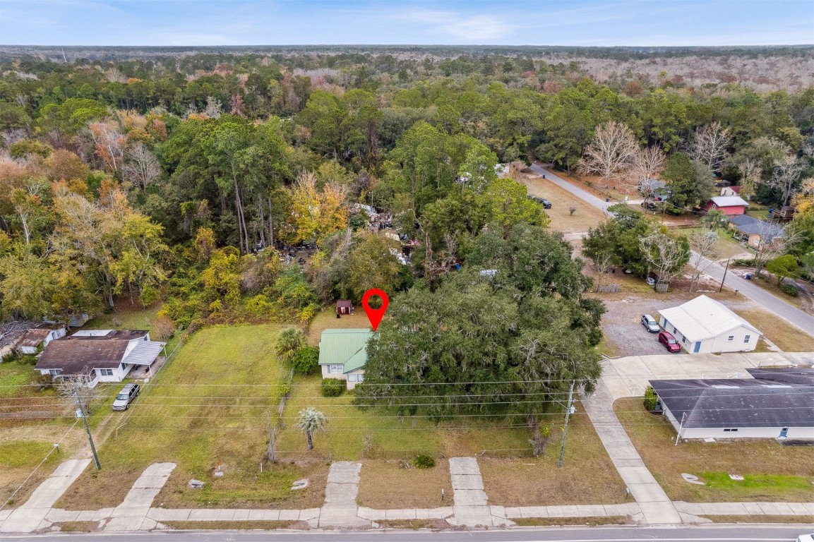 463465 State Road 200 Yulee, FL 32097 - Photo 19 of 20 an aerial view of residential houses with outdoor space