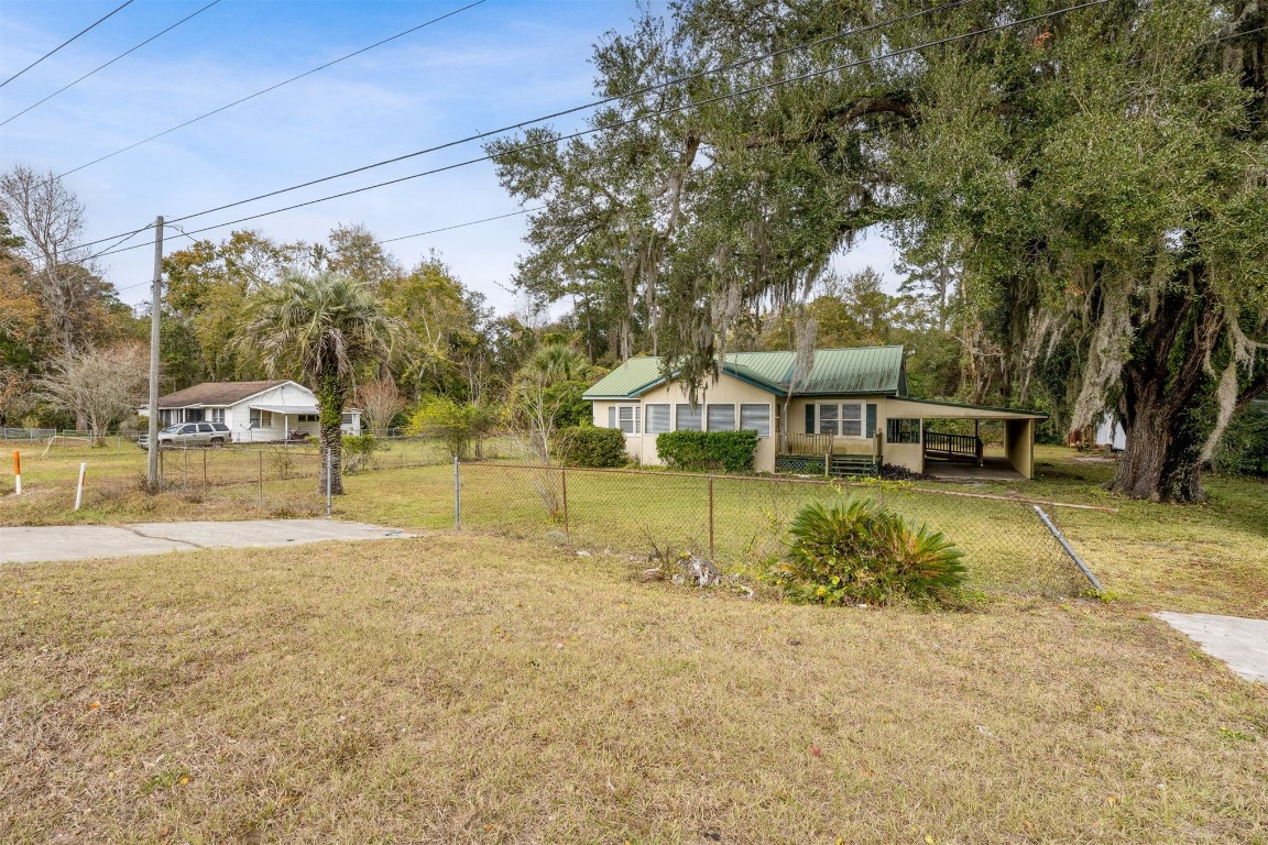 463465 State Road 200 Yulee, FL 32097 - Photo 4 of 20 a view of a house with swimming pool