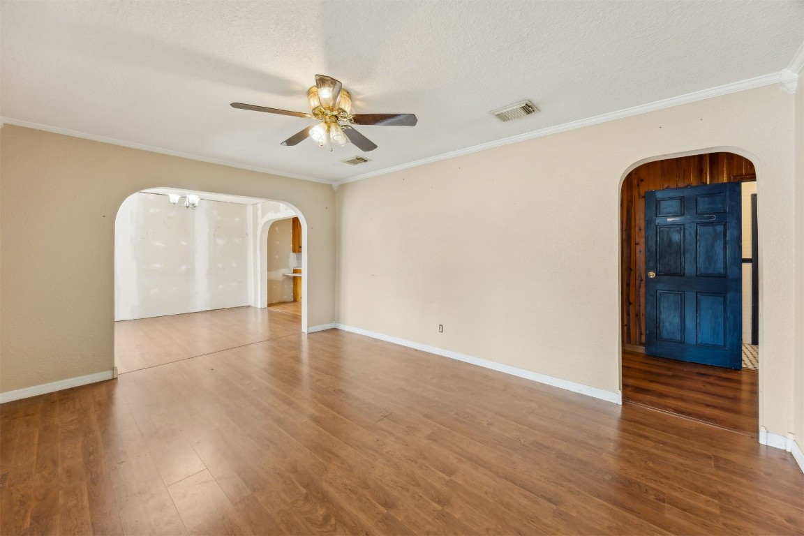 463465 State Road 200 Yulee, FL 32097 - Photo 6 of 20 a view of a livingroom with wooden floor and a ceiling fan