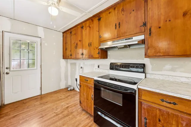 a kitchen with a stove and a microwave